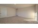 Well-lit bedroom with neutral walls and carpet at 14509 Winged Teal Rd, Charlotte, NC 28278