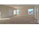 Bright bedroom featuring carpet and dual windows at 14509 Winged Teal Rd, Charlotte, NC 28278