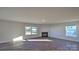 Spacious living room with hardwood floors and fireplace at 14509 Winged Teal Rd, Charlotte, NC 28278