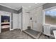 Modern bathroom with a large walk-in shower and herringbone tile floor at 15903 Glen Miro Dr, Huntersville, NC 28078