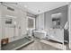 Modern bathroom with double vanities, a freestanding tub, and a large shower at 15903 Glen Miro Dr, Huntersville, NC 28078