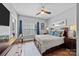 Spacious bedroom with wood floors, large bed, and plenty of dresser space at 15903 Glen Miro Dr, Huntersville, NC 28078