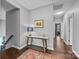 Elegant hallway with hardwood floors and a console table at 15903 Glen Miro Dr, Huntersville, NC 28078