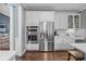 Stainless steel appliances and white cabinetry in kitchen at 15903 Glen Miro Dr, Huntersville, NC 28078