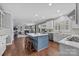 Open concept kitchen with island and hardwood floors at 15903 Glen Miro Dr, Huntersville, NC 28078