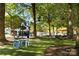 Relaxing park area with artificial turf and benches at 15903 Glen Miro Dr, Huntersville, NC 28078