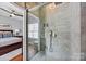 Large walk-in shower with modern tile and fixtures at 15903 Glen Miro Dr, Huntersville, NC 28078