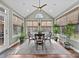 Sunroom with hardwood floors and window seating at 15903 Glen Miro Dr, Huntersville, NC 28078