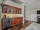 Convenient wet bar with cabinetry and a mini-fridge at 15903 Glen Miro Dr, Huntersville, NC 28078