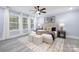 Spacious bedroom with light walls, plush bedding, and large windows at 1938 Grace Ln, Charlotte, NC 28262