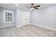 Bright bedroom featuring a ceiling fan and double closet doors at 1938 Grace Ln, Charlotte, NC 28262