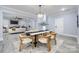 Modern dining room offering views of the living room and kitchen at 1938 Grace Ln, Charlotte, NC 28262