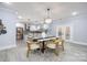 Elegant dining room with a marble table and modern light fixture at 1938 Grace Ln, Charlotte, NC 28262