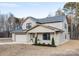 Two-story brick home with a two-car garage and landscaping at 1938 Grace Ln, Charlotte, NC 28262