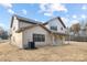 Two-story house with beige siding, black windows, and a covered porch at 1938 Grace Ln, Charlotte, NC 28262