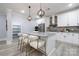 Modern kitchen with white cabinets, granite island, and stainless steel appliances at 1938 Grace Ln, Charlotte, NC 28262