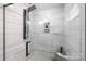 Spa-like shower with multiple shower heads and a built-in seat at 1938 Grace Ln, Charlotte, NC 28262