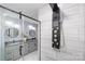 Modern shower with rainfall shower head and sleek glass enclosure at 1938 Grace Ln, Charlotte, NC 28262