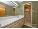 Main bathroom with shower/tub and floral wallpaper at 194 Bynum Rd, Lincolnton, NC 28092