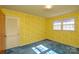 Bedroom featuring yellow floral wallpaper and blue carpet, plus closet at 194 Bynum Rd, Lincolnton, NC 28092