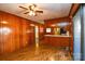 Open dining area with wood paneling and access to kitchen at 194 Bynum Rd, Lincolnton, NC 28092