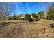 Side view of the house highlighting the backyard and landscaping at 194 Bynum Rd, Lincolnton, NC 28092