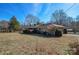 Backyard view of the house showing a large grassy area at 194 Bynum Rd, Lincolnton, NC 28092