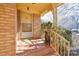 Front porch with decorative railing and a sitting area at 194 Bynum Rd, Lincolnton, NC 28092