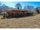 Back exterior of house with deck and yard at 194 Bynum Rd, Lincolnton, NC 28092