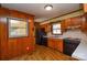 Galley style kitchen with wood cabinets and black appliances at 194 Bynum Rd, Lincolnton, NC 28092