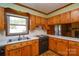 Bright kitchen features wood cabinets, and ample counter space at 194 Bynum Rd, Lincolnton, NC 28092