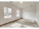 Simple bedroom with hardwood floors and two windows at 205 Benfield Rd, Kings Mountain, NC 28086