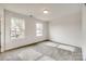 Bright bedroom with neutral carpeting and two large windows at 205 Benfield Rd, Kings Mountain, NC 28086