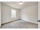 Simple bedroom with grey carpet and a window at 205 Benfield Rd, Kings Mountain, NC 28086