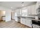 Modern kitchen features white cabinets, granite countertops, and stainless steel appliances at 205 Benfield Rd, Kings Mountain, NC 28086