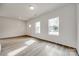 Living room with hardwood floors and two windows at 205 Benfield Rd, Kings Mountain, NC 28086