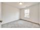 Spacious bedroom with grey carpet and large window at 207 Benfield Rd, Kings Mountain, NC 28086