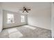 Bright bedroom with neutral carpeting and two large windows at 207 Benfield Rd, Kings Mountain, NC 28086