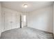 Spacious bedroom with grey carpet and double door closet at 207 Benfield Rd, Kings Mountain, NC 28086