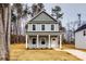 Two-story house with gray siding, white columns, and a front yard at 207 Benfield Rd, Kings Mountain, NC 28086