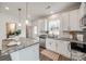 Bright kitchen featuring granite countertops and white cabinetry at 207 Benfield Rd, Kings Mountain, NC 28086