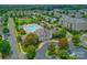 Aerial view of community pool and clubhouse with surrounding homes at 2151 Belle Vernon Ave, Charlotte, NC 28210