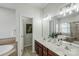 Bathroom with double vanity, tiled floors, and bathtub at 2151 Belle Vernon Ave, Charlotte, NC 28210