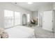 Bedroom with bright natural light, carpet floors and a modern mirror at 2151 Belle Vernon Ave, Charlotte, NC 28210