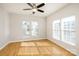 Spacious bedroom with hardwood floors and ceiling fan at 2151 Belle Vernon Ave, Charlotte, NC 28210