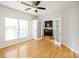 Bright bedroom with hardwood floors, french doors, and built-in shelves at 2151 Belle Vernon Ave, Charlotte, NC 28210