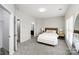 Bright bedroom features neutral walls, carpeted floor, and ensuite bathroom at 2151 Belle Vernon Ave, Charlotte, NC 28210