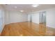 Spacious bonus room featuring gleaming hardwood floors and ample natural light at 2151 Belle Vernon Ave, Charlotte, NC 28210