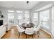 Cozy dining room with hardwood floors, lots of natural light, and stylish furniture at 2151 Belle Vernon Ave, Charlotte, NC 28210