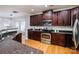 Open kitchen with stainless steel appliances, and wooden cabinets at 2151 Belle Vernon Ave, Charlotte, NC 28210